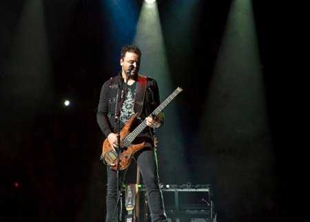 Chris Wolstenholme performs with Muse, New York City (Photo: Live4ever)