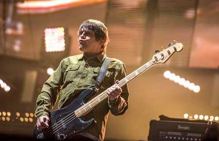 Mani on stage with the Stone Roses at Manchester City's Etihad Stadium, June 17th 2016. (Photo: Gary Mather for Live4ever Media)