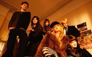 A photo of the band man/woman/chainsaw